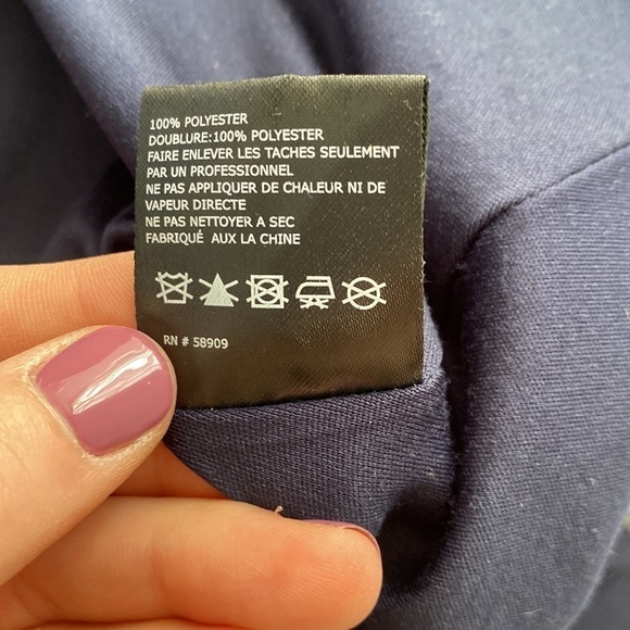 GB formal gown in navy with embroidered pink, yellow, and blue flowers. - Picture 13 of 15